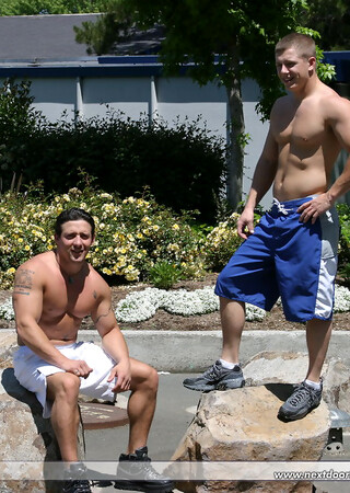 Muscular gay studs Tommy D & Hoyce flaunting their mighty chests outdoors