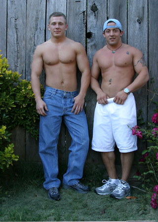 Muscular gay studs Tommy D & Hoyce flaunting their mighty chests outdoors