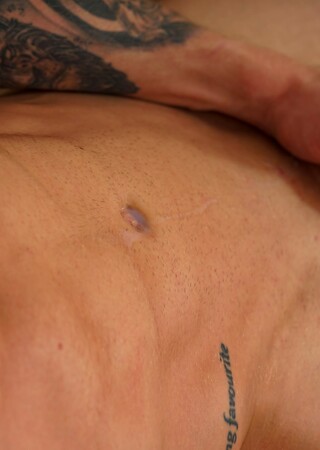 Tattooed uncut athlete Martin Spell jacking off his dick