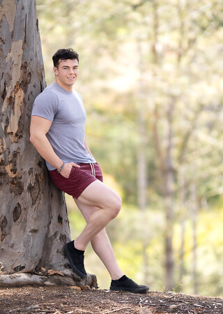 Hunky gay bodybuilder Clark Reid flashes his ass outdoors before posing naked